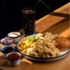 a plate of food on a wooden table