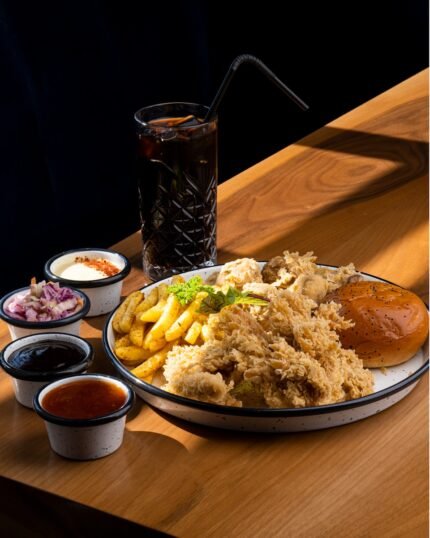 a plate of food on a wooden table